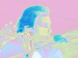 The Coyote performing flute onstage.